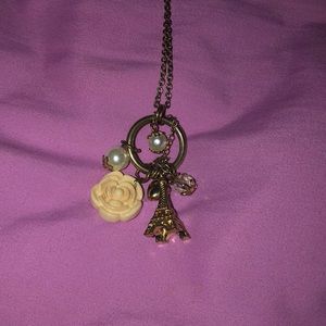long gold chain with charms